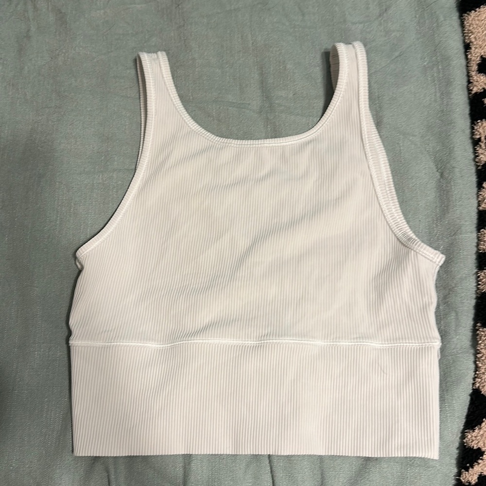 Lululemon white power pivot tank ribbed. Size 10 can fit an 8-10 comfortably